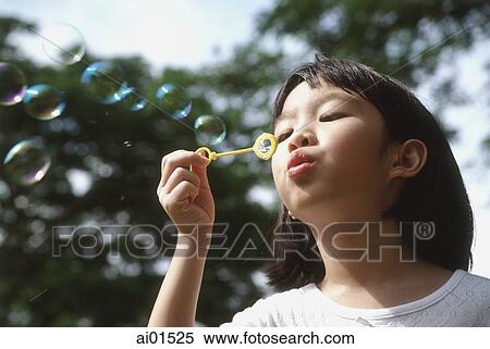 Girl blowing bubbles View Large Photo Image Stock Photography - Girl blowing bubbles. Fotosearch