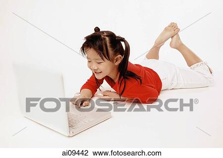 Girl on the floor using laptop. View Large Photo Image Stock Image - Girl on the floor using laptop.. Fotosearch