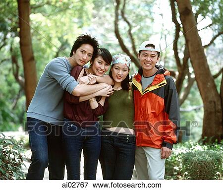 Stock Photo - Group of friends hugging.. Fotosearch