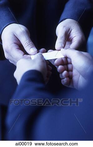 Hands exchanging business card, close up View Large Photo Image Stock Photo - Hands exchanging business card, close up. Fotosearch
