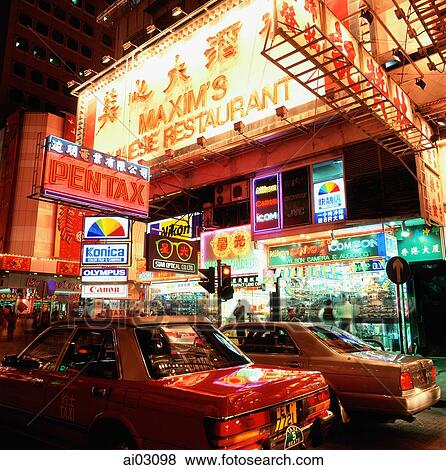 Stock Photo - Hong Kong, Causeway Bay, Busy street scene at night.. Fotosearch