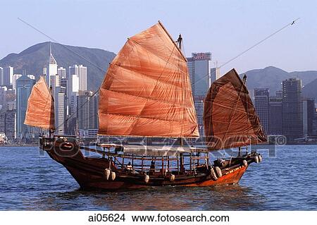 Hong Kong, Victoria Harbor, Chinese junk, buildings in background. View Large Photo Image Picture - Hong Kong, Victoria Harbor, Chinese junk, buildings in background.. Fotosearch