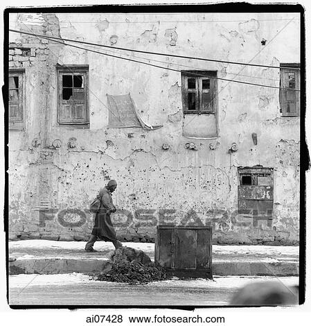 India, Ladakh, Leh, man walking past building. View Large Photo Image Stock Photo - India, Ladakh, Leh, man walking past building.. Fotosearch