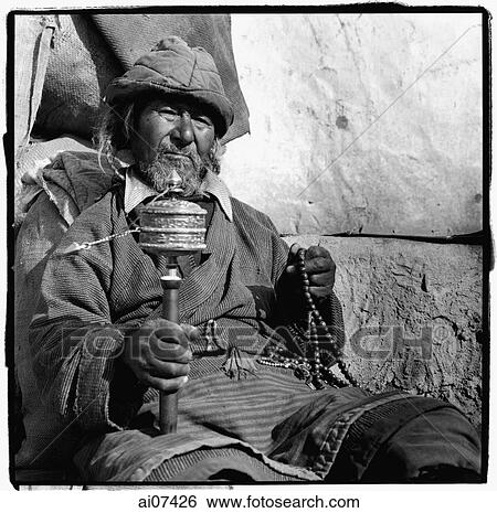 India, Ladakh, Leh, Portrait of Tibetan man holding prayer wheel and prayer beads. View Large Photo Image Stock Photograph - India, Ladakh, Leh, Portrait of Tibetan man holding prayer wheel and prayer beads.. Fotosearch