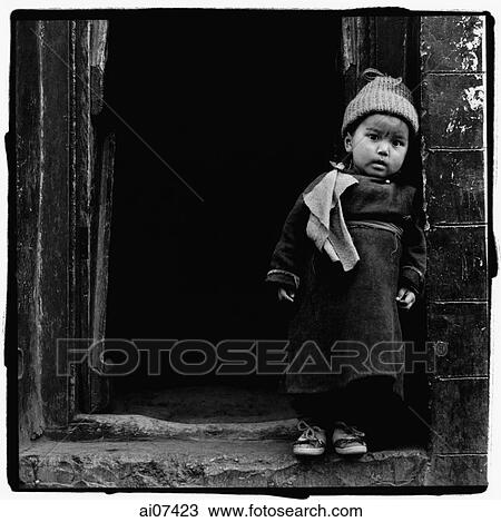 India, Ladakh, Portrait of little boy standing in doorway. View Large Photo Image Stock Image - India, Ladakh, Portrait of little boy standing in doorway.. Fotosearch