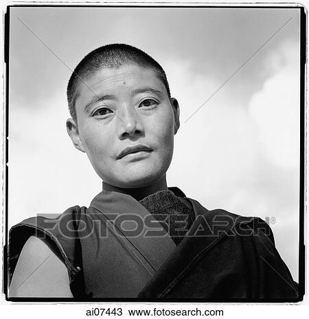 Stock Image - India, near Dharamsala, Dolma Ling Nunnery, Portrait of Tibetan nun.. Fotosearch