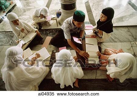Indonesia, Aceh, Banda Aceh, students meet in small groups to learn the Koran with a tutor at the Baiturrahman Great Mosque. View Large Photo Image Stock Photography - Indonesia, Aceh, Banda Aceh, students meet in small groups to learn the Koran with a tutor at the Baiturrahman Great Mosque.. Fotosearch