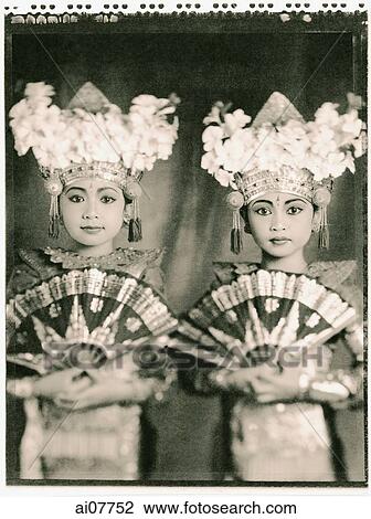Indonesia, Bali, Amlapura, Two Legong dancers in full costumes holding fans. View Large Photo Image Stock Image - Indonesia, Bali, Amlapura, Two Legong dancers in full costumes holding fans.. Fotosearch