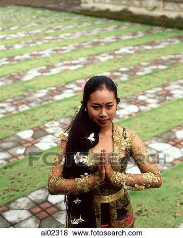 Indonesia, Bali, Balinese dancer in traditional costume, in garden, elevated view View Large Photo Image Stock Photo - Indonesia, Bali, Balinese dancer in traditional costume, in garden, elevated view. Fotosearch