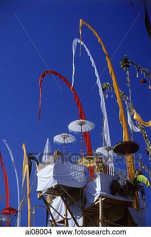 Picture - Indonesia, Bali, Besakih Temple, Umbrellas and umbul-umbul at temple ceremony. (grainy). Fotosearch