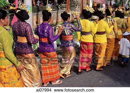 Indonesia, Bali, Candi Dasa, Women in ceremonial dress arrive at temple ceremony. (grainy) View Large Photo Image Picture - Indonesia, Bali, Candi Dasa, Women in ceremonial dress arrive at temple ceremony. (grainy). Fotosearch