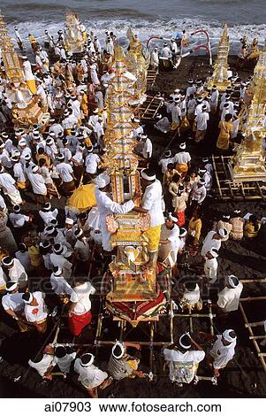 Indonesia, Bali, Gianyar, Pengastian ceremony, men place ceremonial towers on Lebih Beach. (grainy) View Large Photo Image Stock Image - Indonesia, Bali, Gianyar, Pengastian ceremony, men place ceremonial towers on Lebih Beach. (grainy). Fotosearch