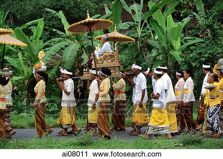 Indonesia, Bali, Gianyar, Pengastian ceremony, worshippers carry priestess to collect holy water. (grainy) View Large Photo Image Stock Image - Indonesia, Bali, Gianyar, Pengastian ceremony, worshippers carry priestess to collect holy water. (grainy). Fotosearch