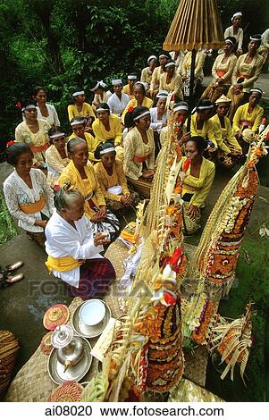 Indonesia, Bali, Gianyar, Pengastian ceremony, priestess leads prayers at holy water collection place. (grainy) View Large Photo Image Stock Image - Indonesia, Bali, Gianyar, Pengastian ceremony, priestess leads prayers at holy water collection place. (grainy). Fotosearch