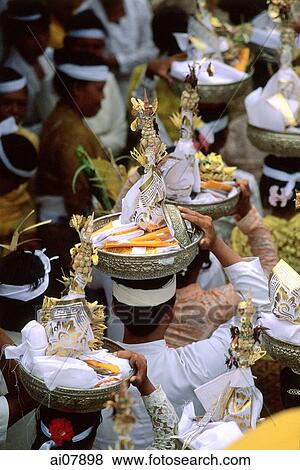 Indonesia, Bali, Gianyar, Pengastian ceremony, worshippers carrying offerings. (grainy) View Large Photo Image Stock Photo - Indonesia, Bali, Gianyar, Pengastian ceremony, worshippers carrying offerings. (grainy). Fotosearch