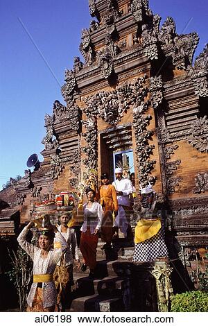 Indonesia, Bali, Hindu festival, People with offerings enter temple via candi bentar (split gates). View Large Photo Image Stock Photo - Indonesia, Bali, Hindu festival, People with offerings enter temple via candi bentar (split gates).. Fotosearch