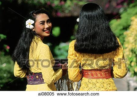 Indonesia, Bali, Kuta, Girls in Balinese ceremonial dress. (grainy) View Large Photo Image Stock Photography - Indonesia, Bali, Kuta, Girls in Balinese ceremonial dress. (grainy). Fotosearch