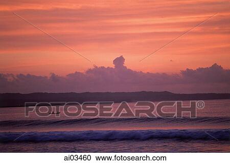 Indonesia, Bali, Kuta, Sunset over ocean, small boat in water View Large Photo Image Stock Image - Indonesia, Bali, Kuta, Sunset over ocean, small boat in water. Fotosearch