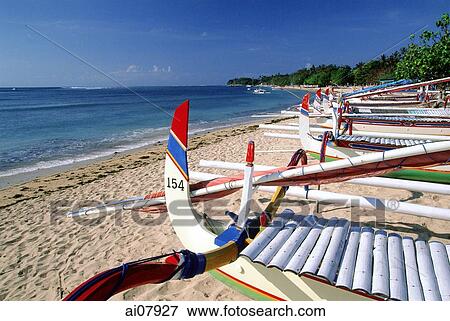 Indonesia, Bali, Sanur Beach, Fishing boats (Jukung) lined up on beach. (grainy) View Large Photo Image Stock Photo - Indonesia, Bali, Sanur Beach, Fishing boats (Jukung) lined up on beach. (grainy). Fotosearch