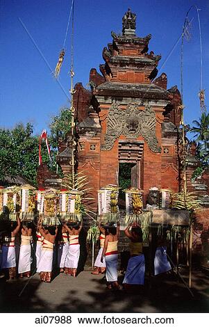 Indonesia, Bali, Sanur, Women carrying offerings at temple ceremony. (grainy) View Large Photo Image Stock Photo - Indonesia, Bali, Sanur, Women carrying offerings at temple ceremony. (grainy). Fotosearch