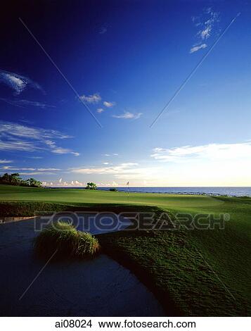 Picture - Indonesia, Bali, Tanah Lot, 14th green towards Indian Ocean Nirwana Bali Golf Club. (grainy). Fotosearch