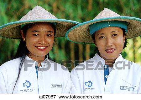 Indonesia, Bali, Tanah Lot, Caddies at Nirwana Bali Golf Club. (grainy) View Large Photo Image Stock Photo - Indonesia, Bali, Tanah Lot, Caddies at Nirwana Bali Golf Club. (grainy). Fotosearch