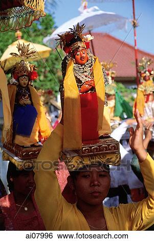 Stock Photograph - Indonesia, Bali, Tanjung Benoa, Women carrying effigies at Melasti ceremony. (grainy). Fotosearch