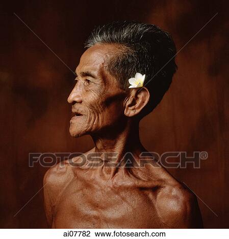 Indonesia, Bali, Ubud, Mature Balinese man with Frangipani flower adornment. View Large Photo Image Stock Image - Indonesia, Bali, Ubud, Mature Balinese man with Frangipani flower adornment.. Fotosearch