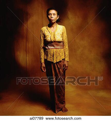 Indonesia, Bali, Ubud, Middle-aged Balinese woman in temple dress. View Large Photo Image Stock Photo - Indonesia, Bali, Ubud, Middle-aged Balinese woman in temple dress.. Fotosearch