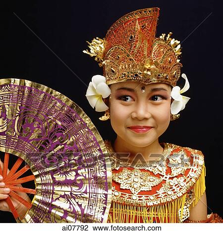 Indonesia, Bali, Ubud, Panji Semirang dancer in full costume holding fan. View Large Photo Image Stock Image - Indonesia, Bali, Ubud, Panji Semirang dancer in full costume holding fan.. Fotosearch