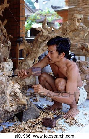 Indonesia, Bali, Ubud, Woodcarver at work. (grainy) View Large Photo Image Stock Photograph - Indonesia, Bali, Ubud, Woodcarver at work. (grainy). Fotosearch