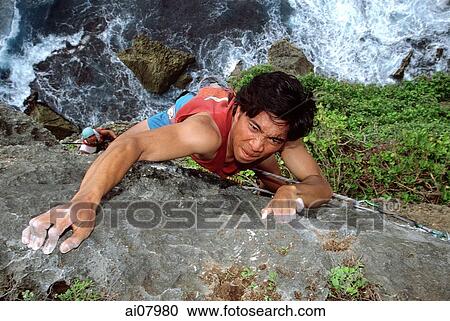 Indonesia, Bali, Uluwatu, Rock climbing on cliffs. (grainy) View Large Photo Image Stock Image - Indonesia, Bali, Uluwatu, Rock climbing on cliffs. (grainy). Fotosearch