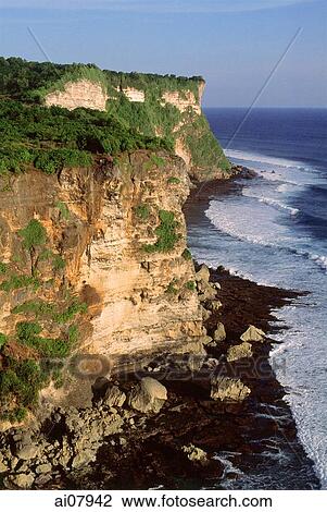 Indonesia, Bali, Uluwatu, View of cliffs and temple. (grainy) View Large Photo Image Stock Image - Indonesia, Bali, Uluwatu, View of cliffs and temple. (grainy). Fotosearch