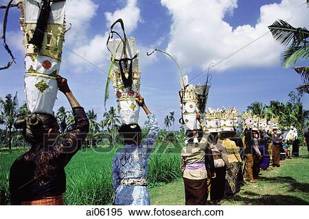 Indonesia, Bali, Women carrying offerings on their heads going to temple festival. View Large Photo Image Stock Photography - Indonesia, Bali, Women carrying offerings on their heads going to temple festival.. Fotosearch