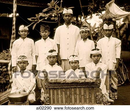Stock Image - Indonesia, Bali, young boys in traditional costume. Fotosearch