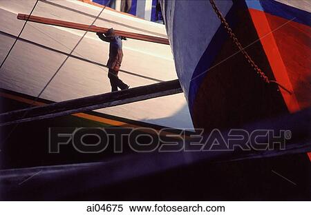 Indonesia, Jakarta, Sunder kelapa, men unloading goods from boats. View Large Photo Image Stock Photography - Indonesia, Jakarta, Sunder kelapa, men unloading goods from boats.. Fotosearch