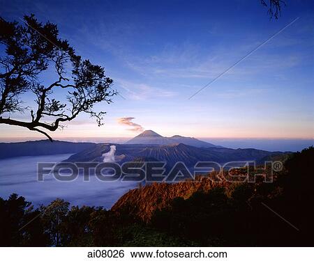 Indonesia, Java, Mount Bromo, Sunrise across Bromo-Semeru caldera from Mount Penanjakken. (grainy) View Large Photo Image Stock Photograph - Indonesia, Java, Mount Bromo, Sunrise across Bromo-Semeru caldera from Mount Penanjakken. (grainy). Fotosearch