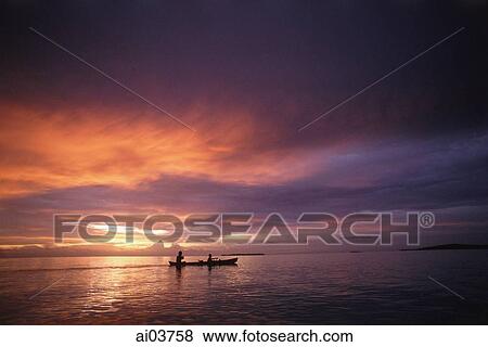 Indonesia, Kei Islands, sunset, boat on water View Large Photo Image Stock Photo - Indonesia, Kei Islands, sunset, boat on water. Fotosearch