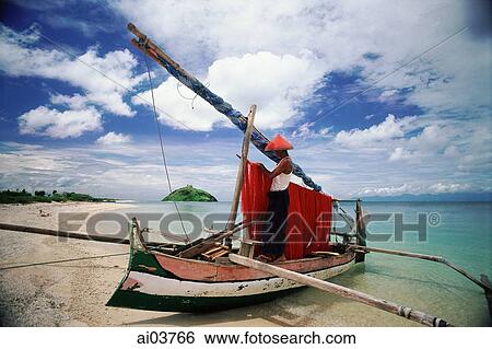 Indonesia, Lombok, Fisherman tending nets on beach View Large Photo Image Stock Photograph - Indonesia, Lombok, Fisherman tending nets on beach. Fotosearch