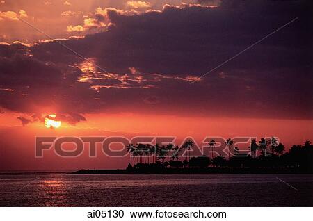 Stock Image - Indonesia, Lombok, Sunset over the water.. Fotosearch