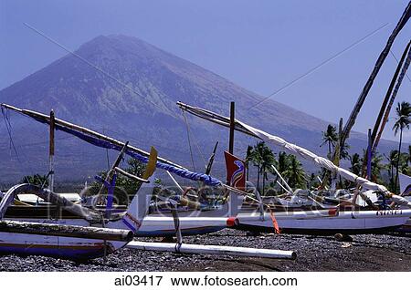 Indonesia, Northern Bali, Amed, Boats in foreground, Mt. Agung in background. View Large Photo Image Stock Photo - Indonesia, Northern Bali, Amed, Boats in foreground, Mt. Agung in background.. Fotosearch