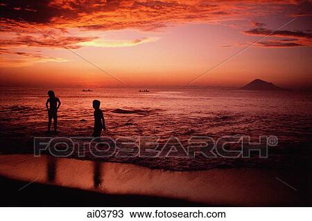 Indonesia, Sulawesi, Manado, Sunset on beach at Bunaken Island. View Large Photo Image Stock Image - Indonesia, Sulawesi, Manado, Sunset on beach at Bunaken Island.. Fotosearch