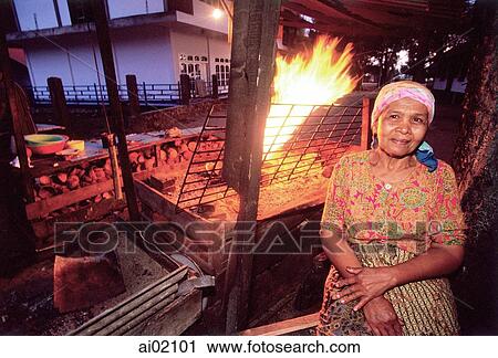 Indonesia, Sumatra, Aceh, Acehnese woman selling grilled meat at Sunset Beach. View Large Photo Image Stock Image - Indonesia, Sumatra, Aceh, Acehnese woman selling grilled meat at Sunset Beach.. Fotosearch