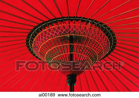 Stock Photo - Japan, red waxed paper umbrella, close up. Fotosearch