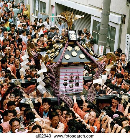 Japan, Tokyo, Portable shrine (mikoshi) is carried through the streets during Asakusa Matsuri (religious festival) View Large Photo Image Stock Image - Japan, Tokyo, Portable shrine (mikoshi) is carried through the streets during Asakusa Matsuri (religious festival). Fotosearch