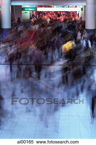 Stock Photography - Japan, Tokyo, Shibuya, rush hour in modern shopping complex, incl. station. Fotosearch