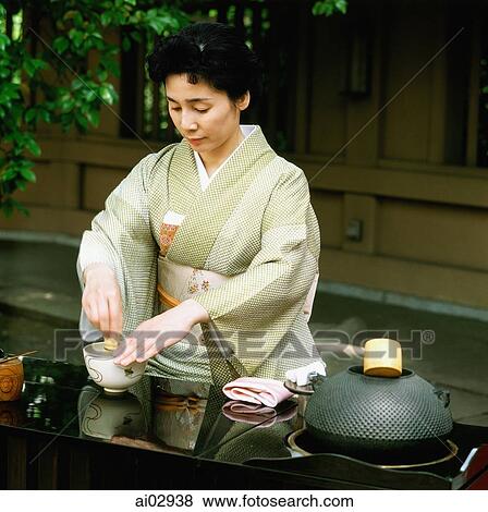 Japan, Woman in kimono performing outdoor tea ceremony View Large Photo Image Stock Photo - Japan, Woman in kimono performing outdoor tea ceremony. Fotosearch