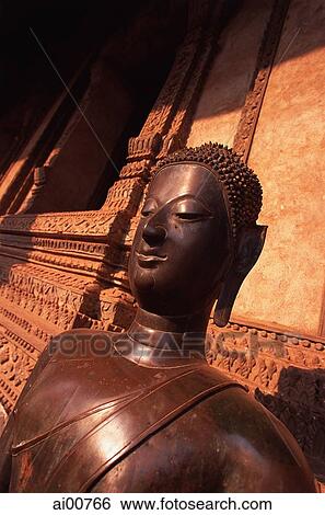 Laos, Vientiane, Buddha statue in the corridor of Wat Phra Keo View Large Photo Image Stock Photograph - Laos, Vientiane, Buddha statue in the corridor of Wat Phra Keo. Fotosearch