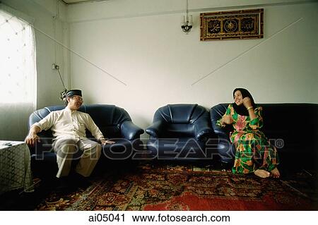 Malaysia, Abdullah Juhaidi and his wife Zainab stealing a few moments during the Hari Raya Adilfitri holidays. Juhaidi is a convert to Islam. View Large Photo Image Stock Image - Malaysia, Abdullah Juhaidi and his wife Zainab stealing a few moments during the Hari Raya Adilfitri holidays. Juhaidi is a convert to Islam.. Fotosearch