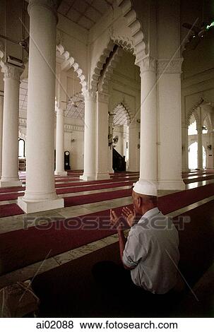 Stock Photo - Malaysia, Johor Bahru, Muslim man pray at Sultan Abu Bakar Mosque.. Fotosearch